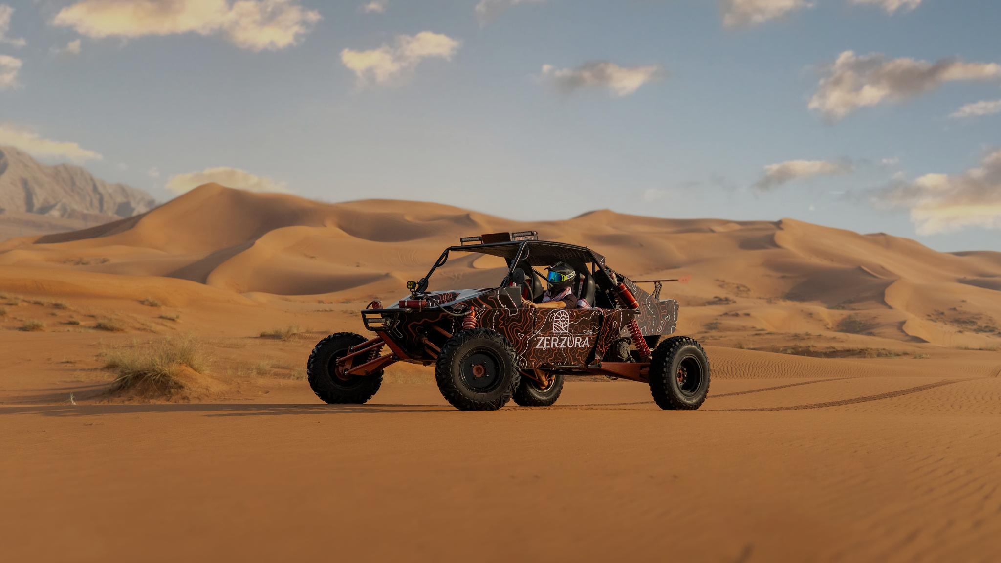 Self drive dune buggy riding across sand dunes in Mleiha desert near Dubai