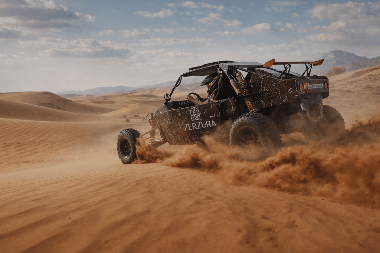 Driver enjoying dune buggy ride through golden sand dunes in Mleiha Sharjah
