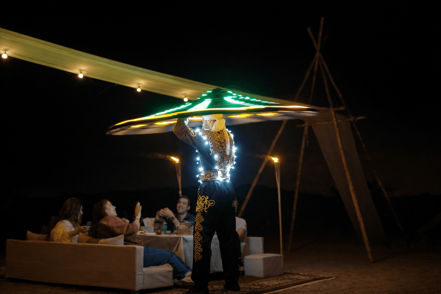 LED Tanoura dancer performing during Zerzura desert camp dinner in Mleiha