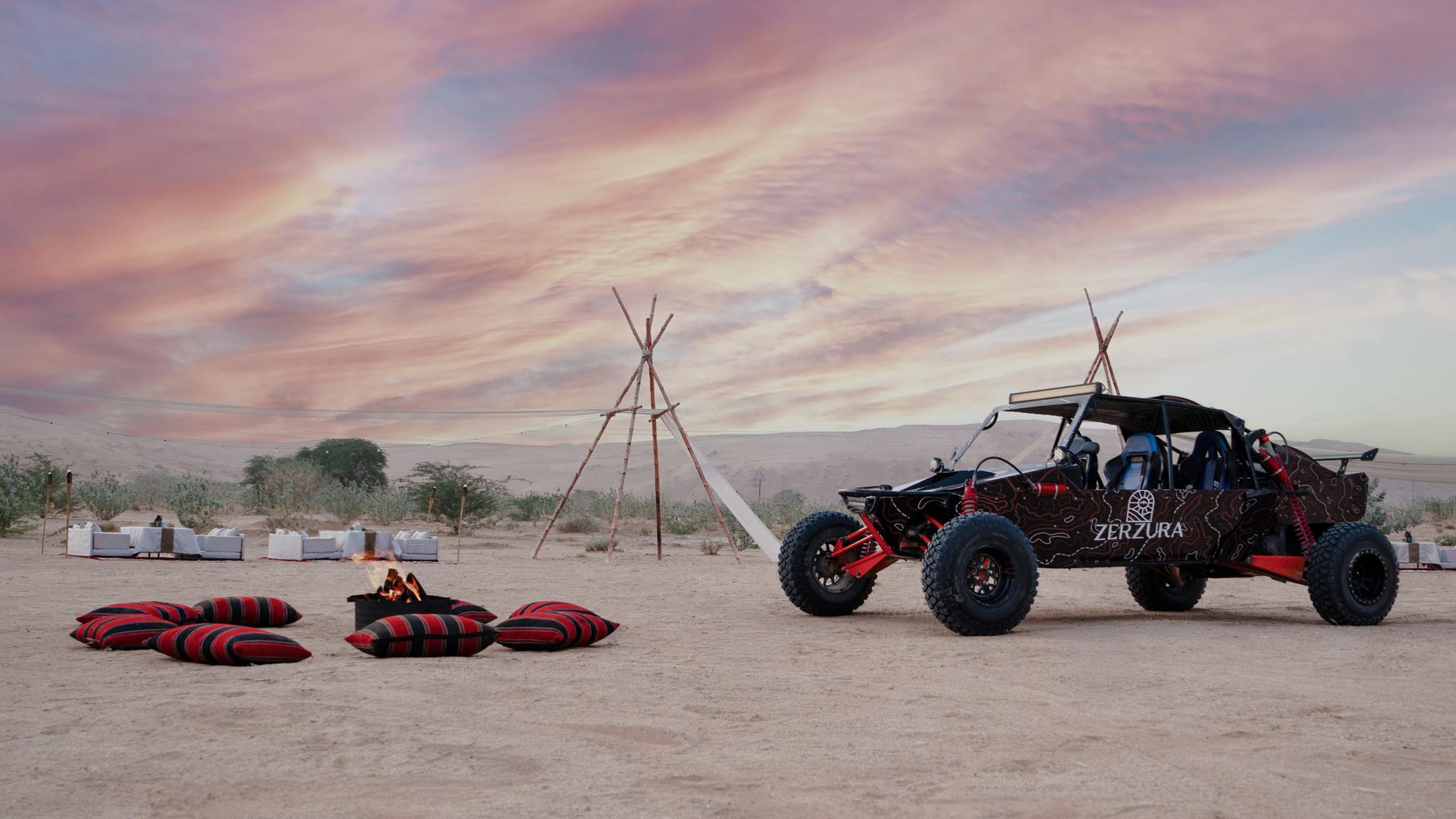 Luxury desert dinner setup in Mleiha during Zerzura dune buggy dining experience